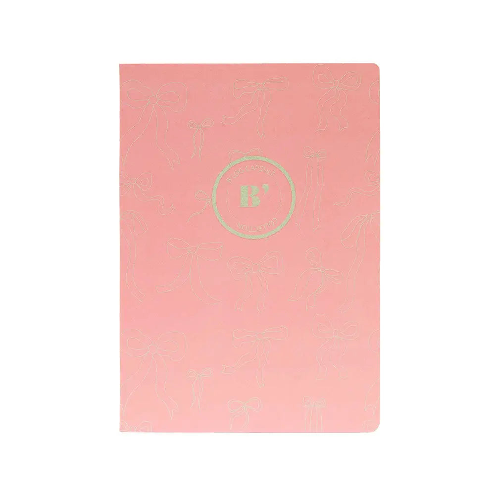 Caderno agrafado A4 quadriculado rosa da marca Ancor com 48 folhas, ideal para anotações e estudos.